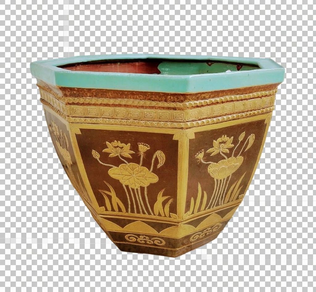 Decorative hexagonal ceramic planter with floral patterns.