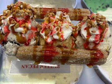 Made with a warm Churro dipped in cinnamon,topped with 3 scoops of our premium Ice cream, whip cream