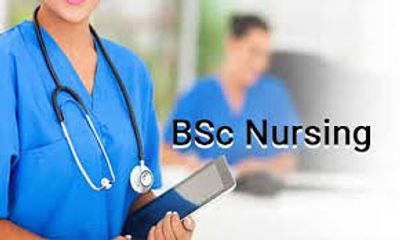 A nurse in blue scrubs holding a tablet with 'BSc Nursing' text.