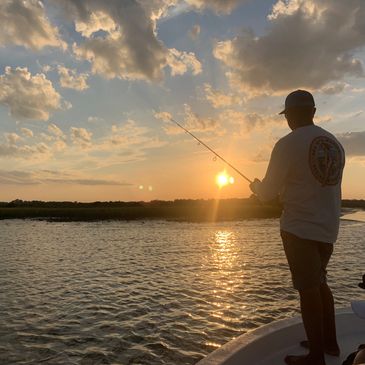 man fishing sunset boat inshore nearshore ocean beach Florida hope floats