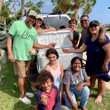 happy families scallop beach Florida charter fishing smiling kids children adults mixed teen 
