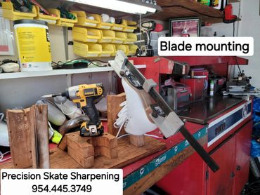 Workspace for blade mounting and skate sharpening.