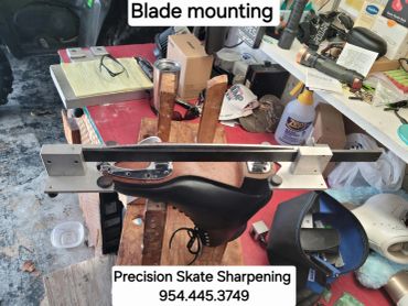 Blade mounting setup for skate sharpening.