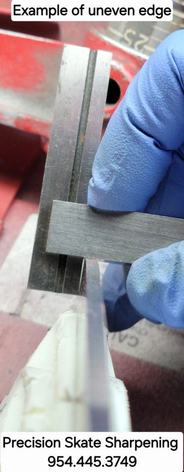 Measuring uneven edge on skate blade with a ruler.