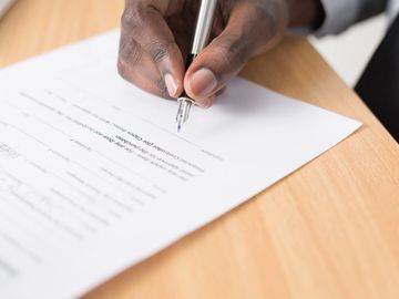 A person signing a document