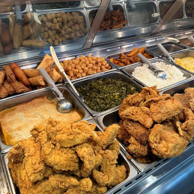 Hot & fresh deli food featuring fried chicken, collard greens, mashed potatoes, and mac & cheese