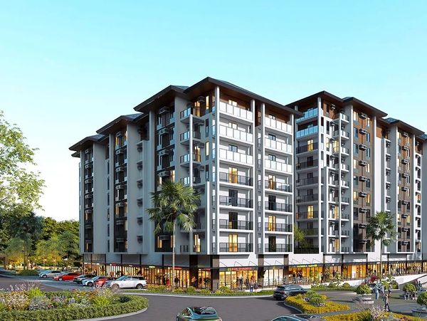 Modern apartment complex with retail space on the ground floor.