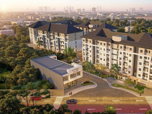 Modern apartment complex in a city setting at sunset.