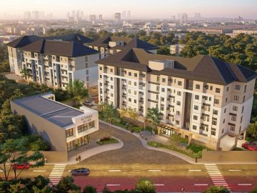 Modern apartment complex with a clubhouse in an urban setting.