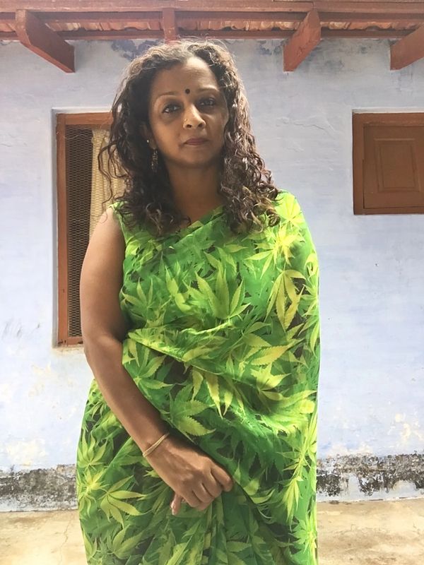 A scenic landscape featuring mountains, a river, and a vibrant sky at sunset.