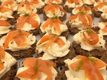 Smoked Salmon & Cream Cheese Rye Bread Canapes on a serving platter.