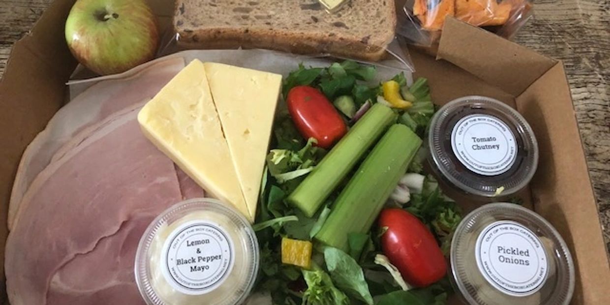 Ploughmans Lunch for One served with bread and butter in a box.