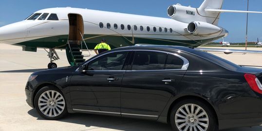 private jet limo service, private airport pick up service, black sedan, executive transportation