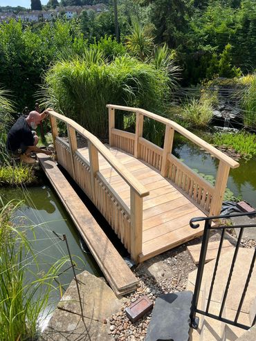 Oak Bridge Over a Pond 