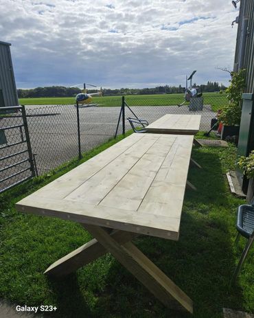 outdoor wooden tables created by pinewood designs for an airfield in kent 