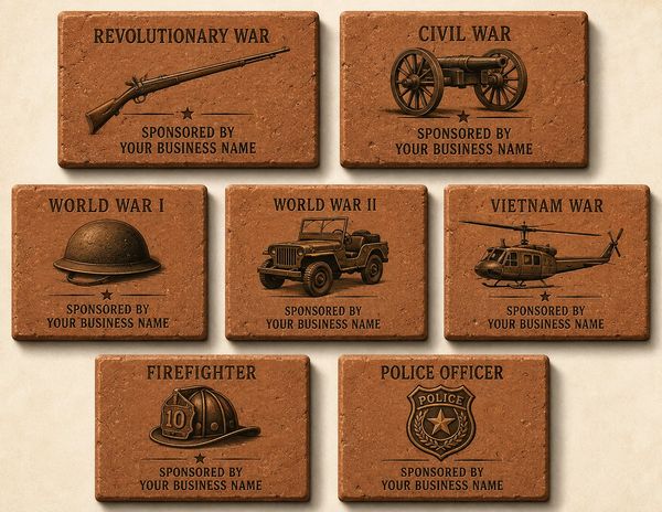 Seven engraved bricks with war and service themes.