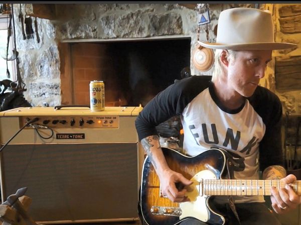 Guitarist, guitar, and amp.