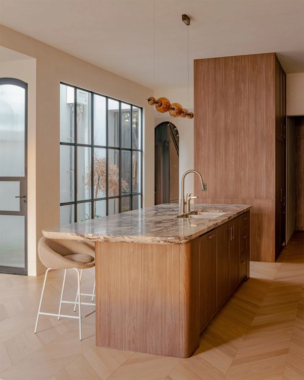Canterbury stone kitchen island and timber joinery in Middle Park. Photography: Victor Vieaux.