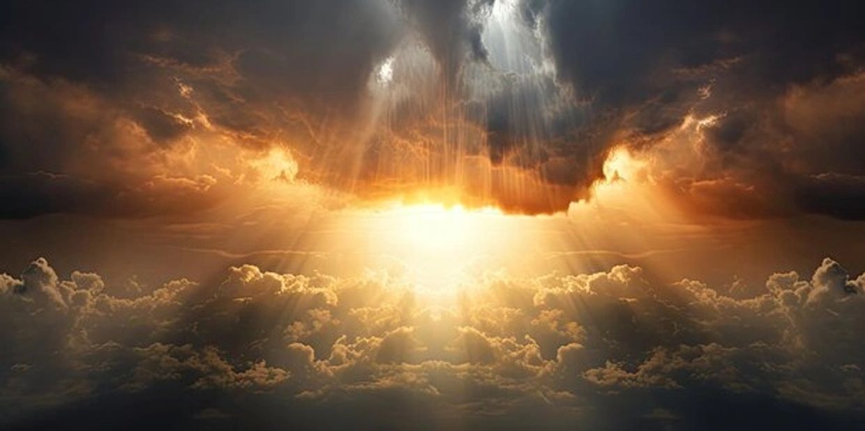 Sunlight breaks through dramatic clouds, illuminating the sky with golden rays.