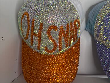 Beautifully customized rhinestone hat that says “Oh Snap”