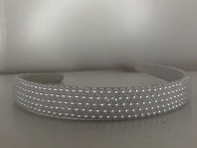 Beautifully customized solid white pearl headband!