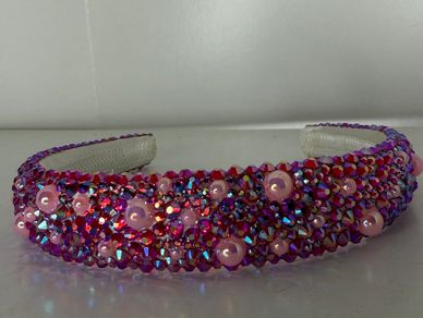 Beautifully customized rhinestone headband with red color changing rhinestones and pink pearls!