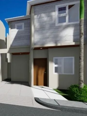 Modern two-story house with gray walls and a brown door under bright sunlight.