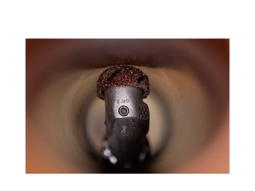A robotic pipe cutter inside a pipe