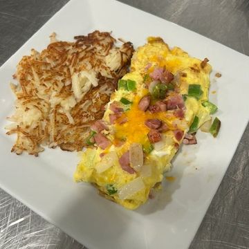 Two egg omelet with tender ham, onion, green peppers and cheese blend with a side of hashbrowns. 
