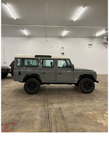 1991 Gray Land Rover Defender 110 side view with BF Goodrich All-Terrain tires.