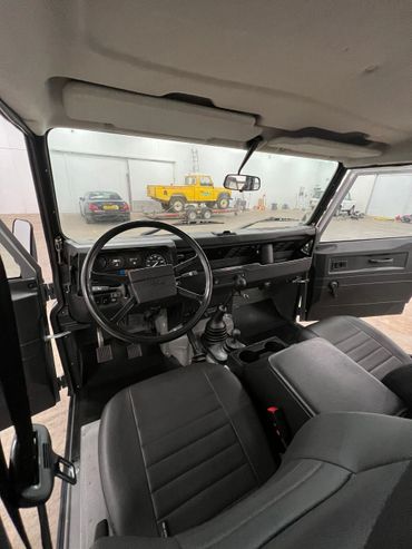 1991 Gray Land Rover Defender 110 front interior view picture. 