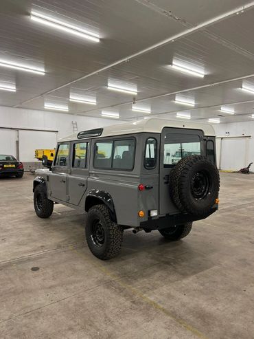 1991 Gray Land Rover Defender 110 rear side view BF Goodrich All-Terrain tires.