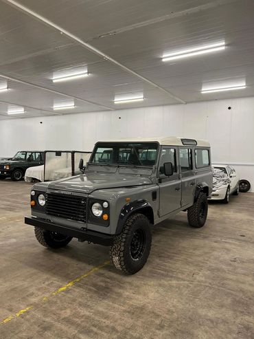 1991 Gray Land Rover Defender 110 front angle picture.