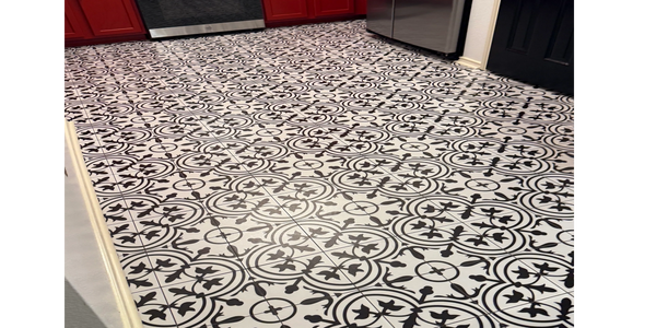 A intricate black &white pattern has a Mediterranean sophisticated vibe with the bold red ca