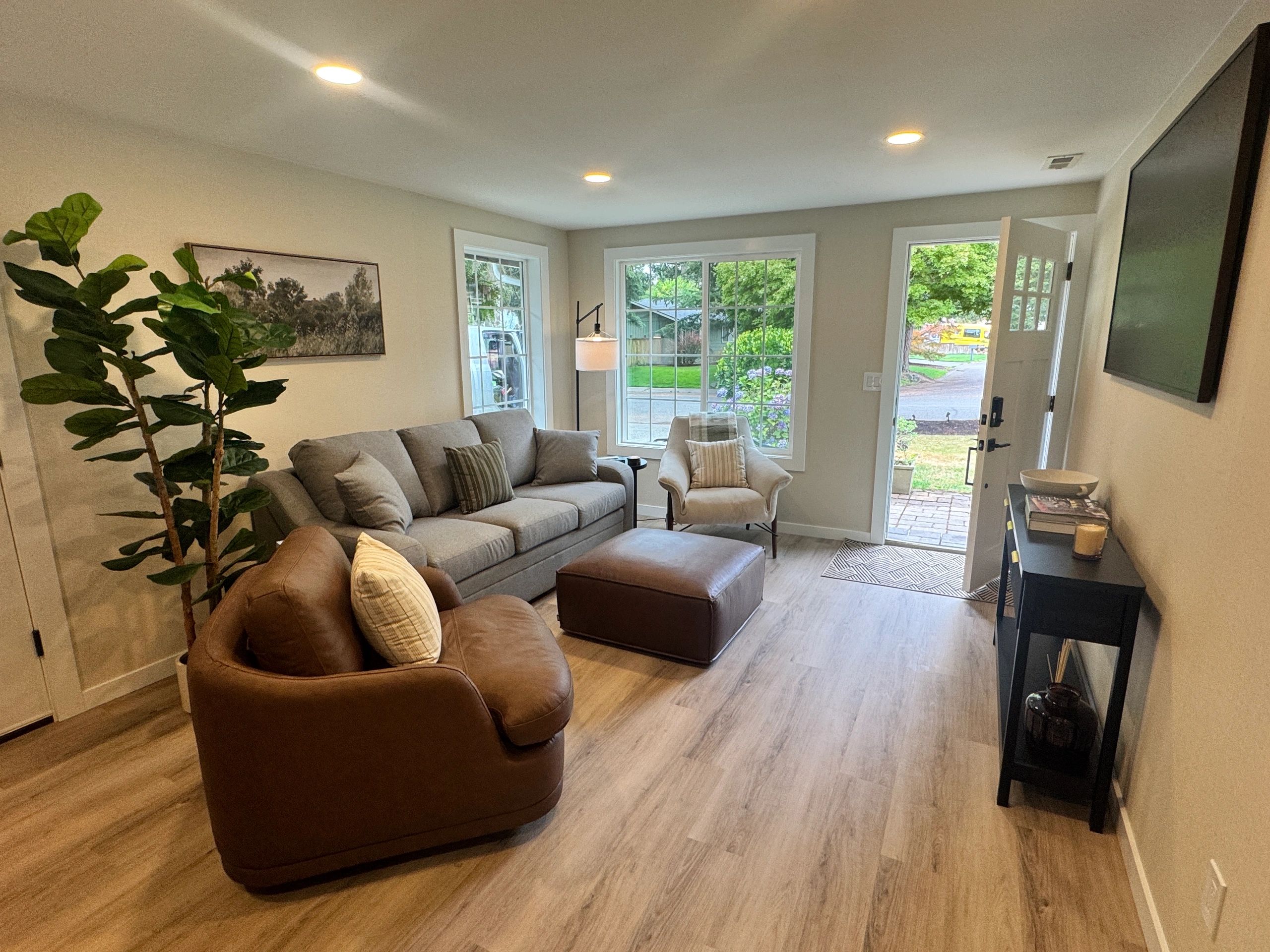 Cozy living room with comfortable seating and natural light.