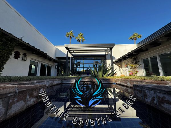 Modern building with a pool and logo overlay.