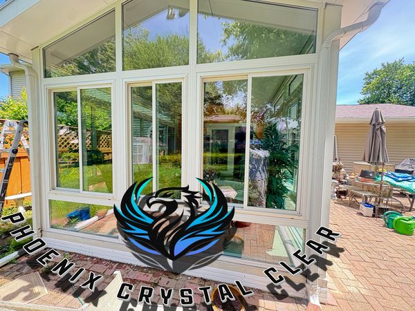 Modern glass window installation on a sunny day.