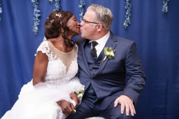 Bride and groom kissing at their wedding.