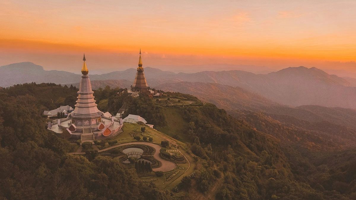 Experience the breathtaking beauty of Doi Inthanon National Park, home to Thailand’s highest peak (2,565 meters) and the iconic Twin Royal Pagodas dedicated to the late King and Queen. Located in Ban Luang, Chiang Mai, this scenic wonder is famous for its cool climate, stunning sunrise views, lush cloud forests, and cascading waterfalls. Whether you're hiking the Kew Mae Pan Nature Trail, birdwatching, or capturing the magical misty landscapes at sunrise, Doi Inthanon is a must-visit destination for nature lovers and adventure seekers in Thailand.