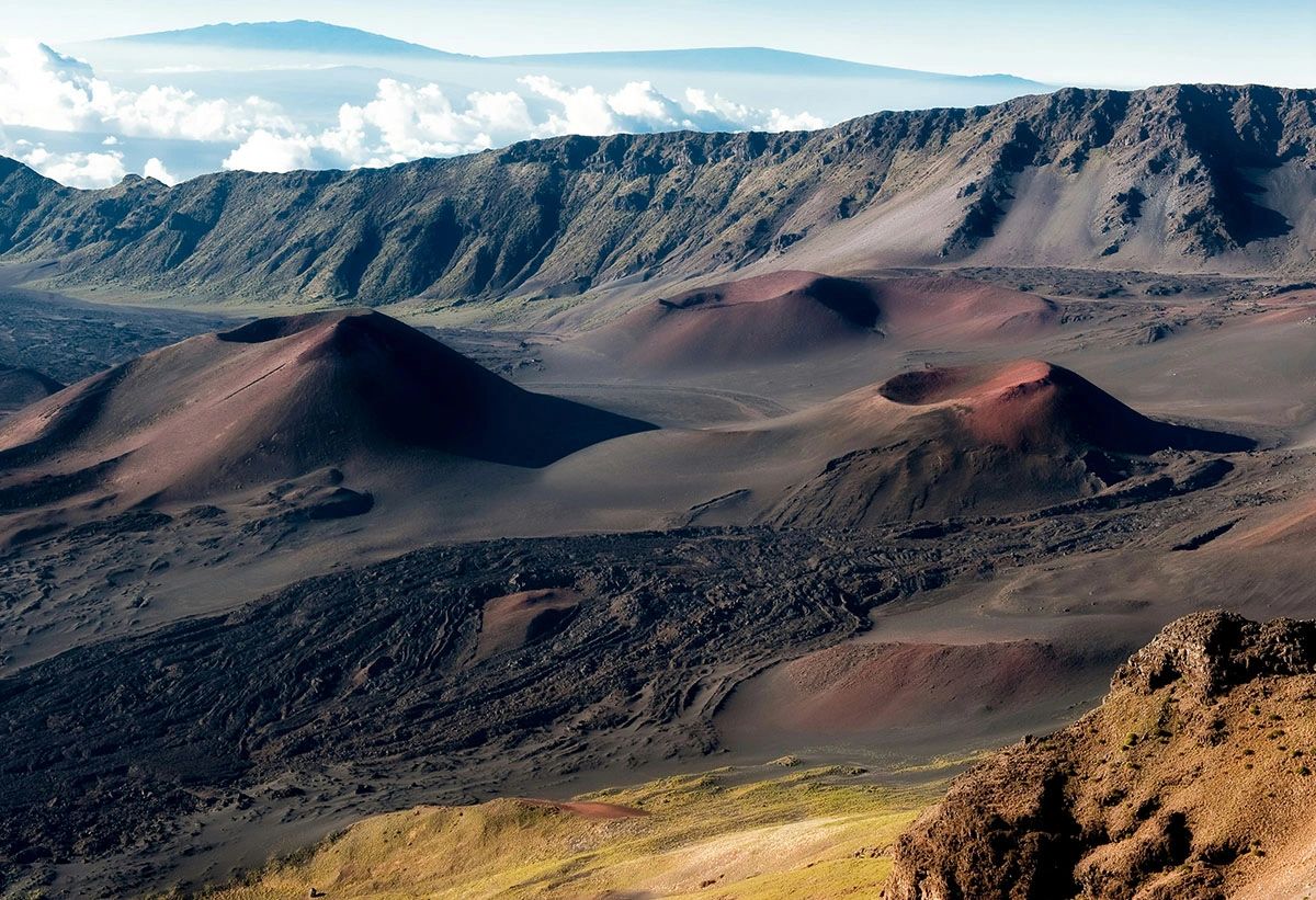 Volcanic cinder cones and rust-colored landscape inside Haleakalā crater in Maui's Haleakalā National Park