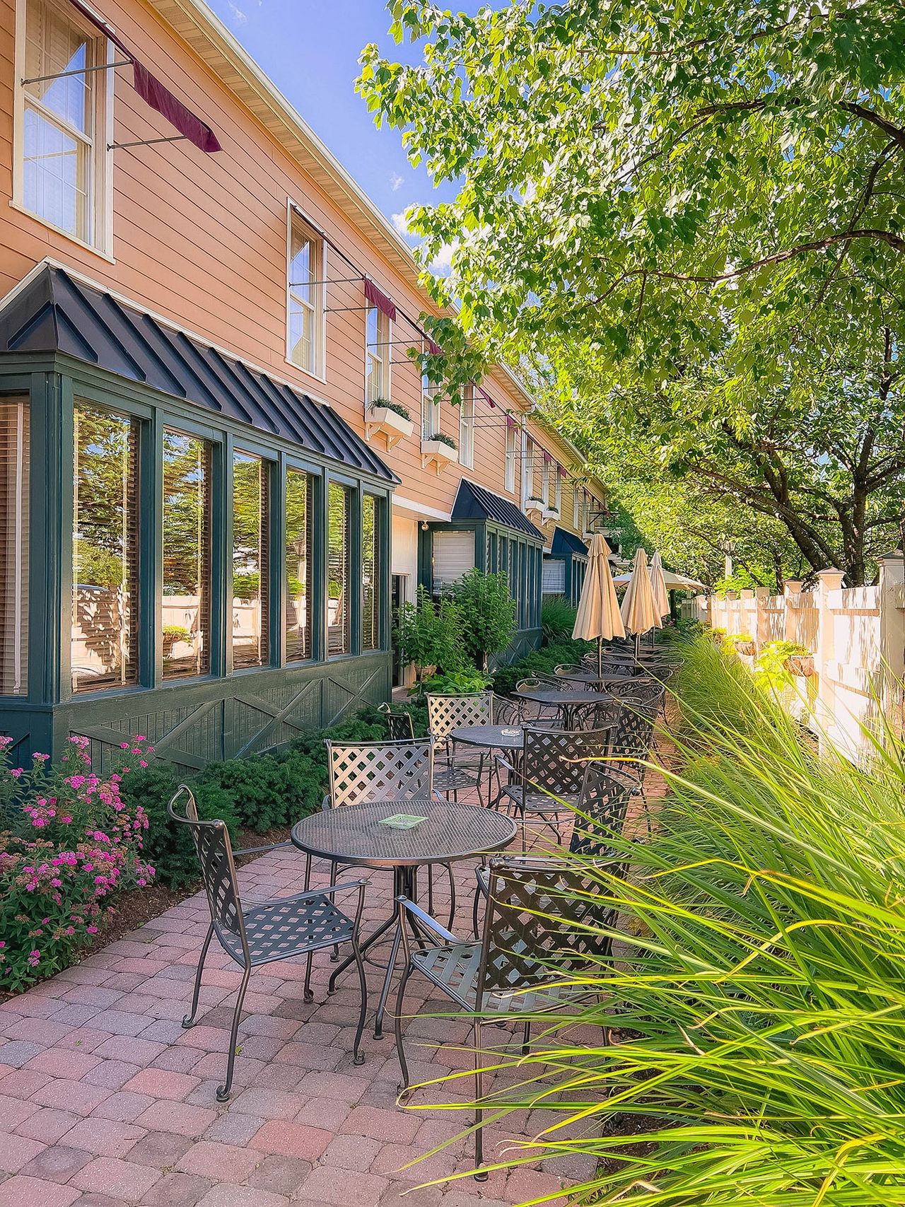 Escape to the peaceful charm of Leola, Pennsylvania, where this picturesque outdoor dining patio invites you to relax under the shade of lush trees. Nestled in Lancaster County, this hidden gem offers a serene and cozy atmosphere, perfect for enjoying a quiet meal or a cup of coffee. With its beautifully manicured gardens, rustic architecture, and intimate ambiance, this spot captures the essence of small-town Pennsylvania charm. The Inn at Leola Village