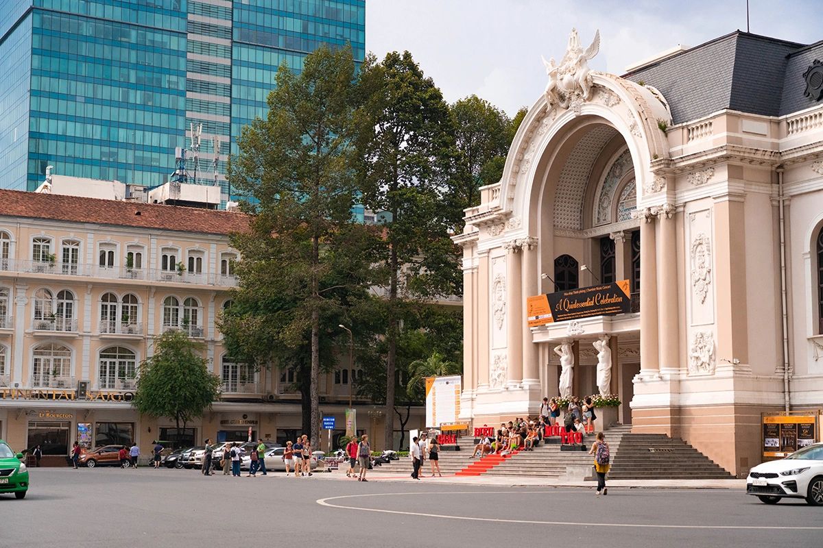 Elegant Saigon Opera House with ornate French colonial facade beside modern buildings – architectural contrasts in this Ho Chi Minh City guide
