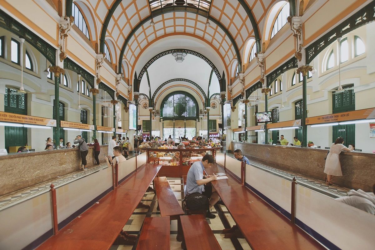 Saigon Central Post Office's grand vaulted interior with colonial-era architectural details – a must-visit landmark in this Ho Chi Minh City guide