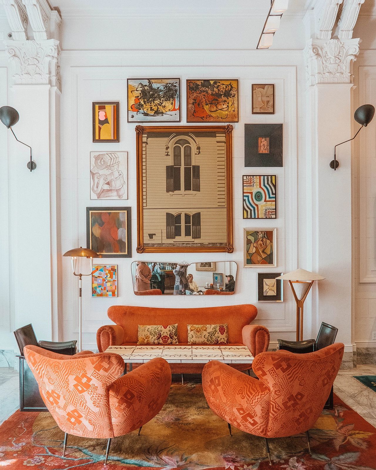 Eclectic and artful lobby at the San Francisco Proper Hotel, featuring vibrant vintage furniture, colorful wall art, bold patterns, and historic architectural details. Designed by Kelly Wearstler, the Proper Hotel’s lobby blends luxury with playful, curated design, offering a truly unique and stylish welcome to guests visiting San Francisco.