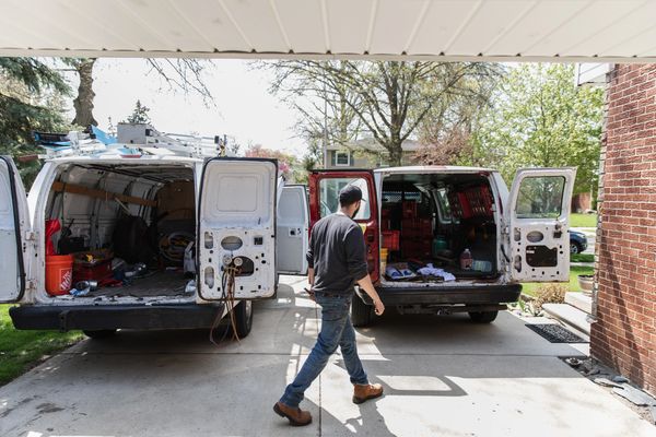 A technician checking for parts for a repair and inspection of a quality heating and cooling system.