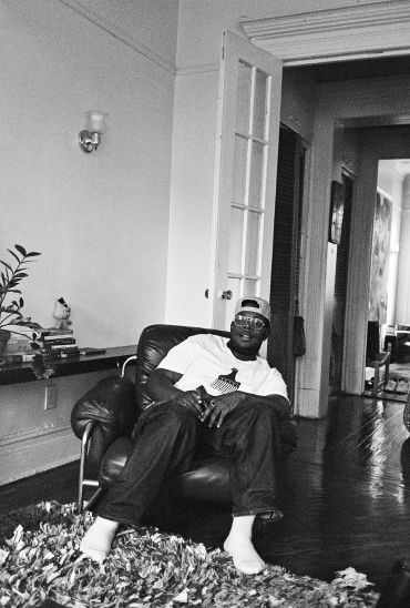 Man relaxing in a chair indoors.