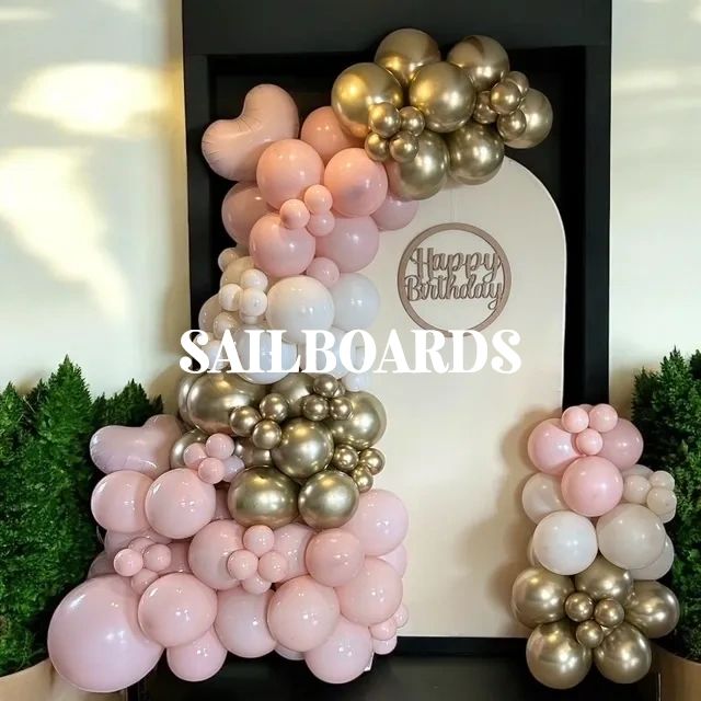 Elegant birthday balloon arrangement with gold and pink tones.