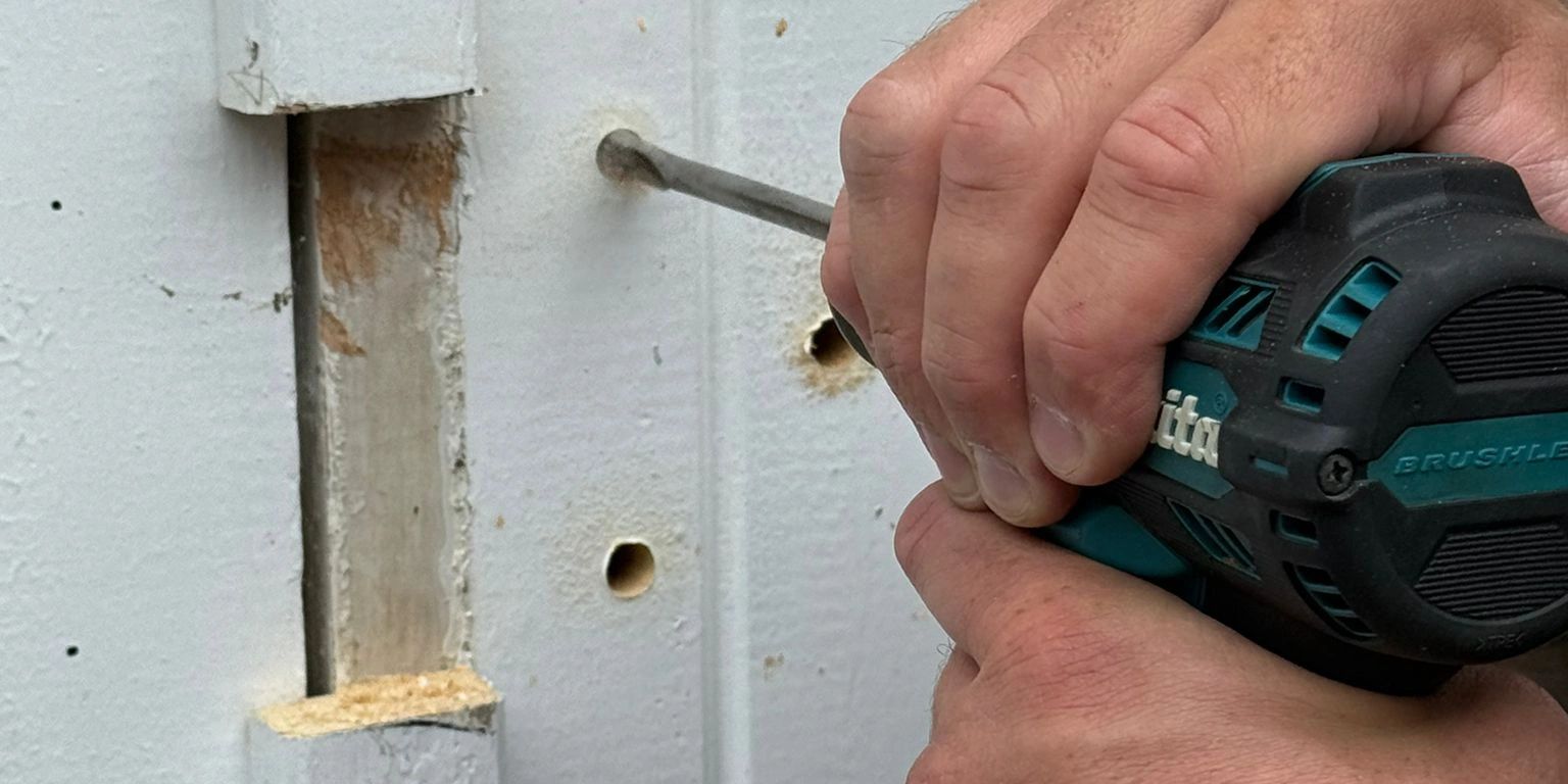 Local Bradford locksmith changing door lock