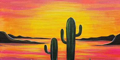Sunset behind cactuses in a desert.