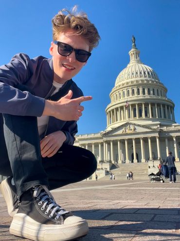 Jamie Moreland posing outside the Capitol building in Washington DC